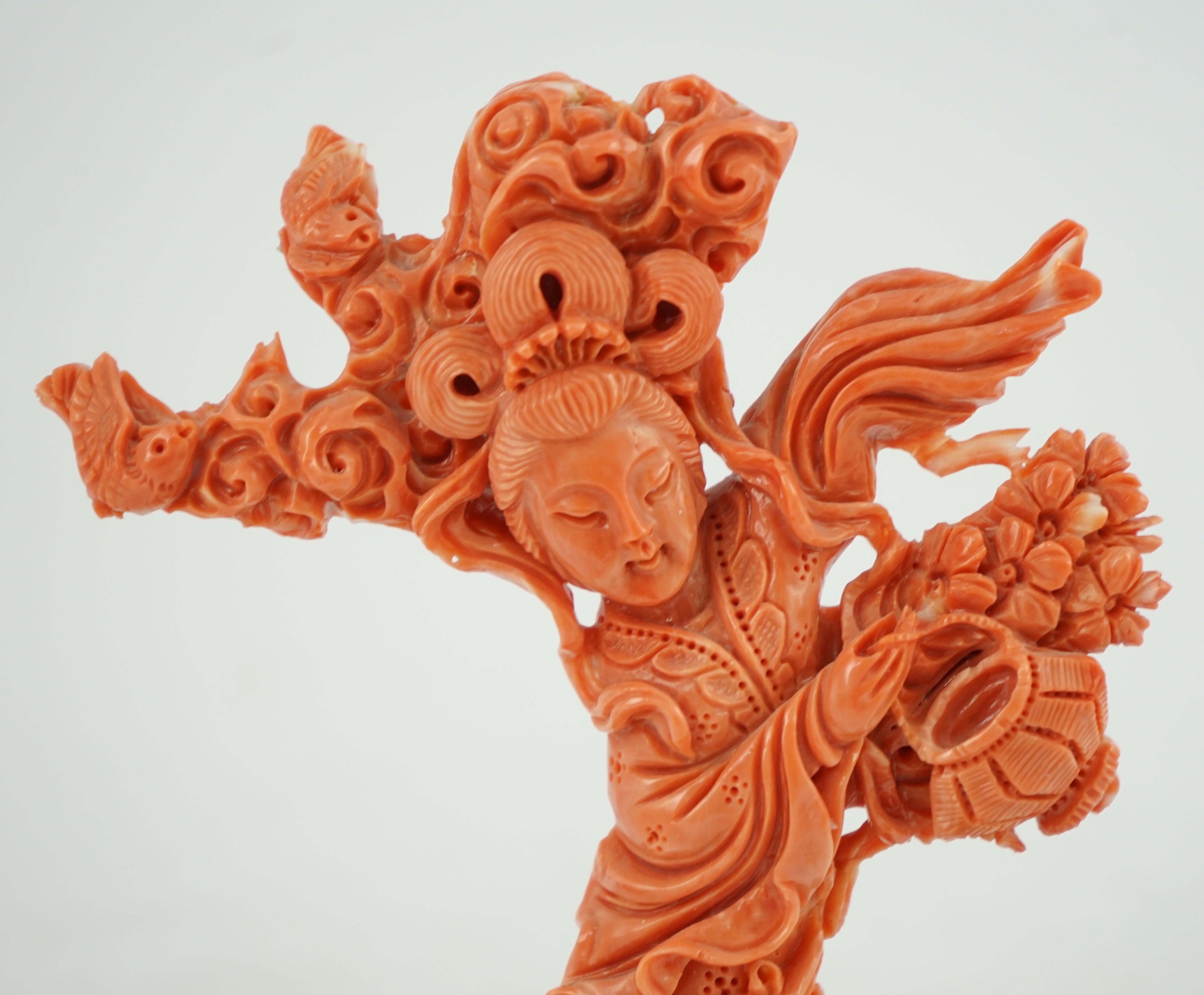 A large Chinese coral carving of a flower fairy, mid 20th century